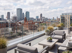 City balcony fitted with a fully frameless glass balustrade, creating a sleek and contemporary outdoor space