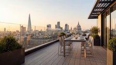 Fully frameless glass balustrade installed on a city balcony, creating a sleek safety barrier with uninterrupted urban views