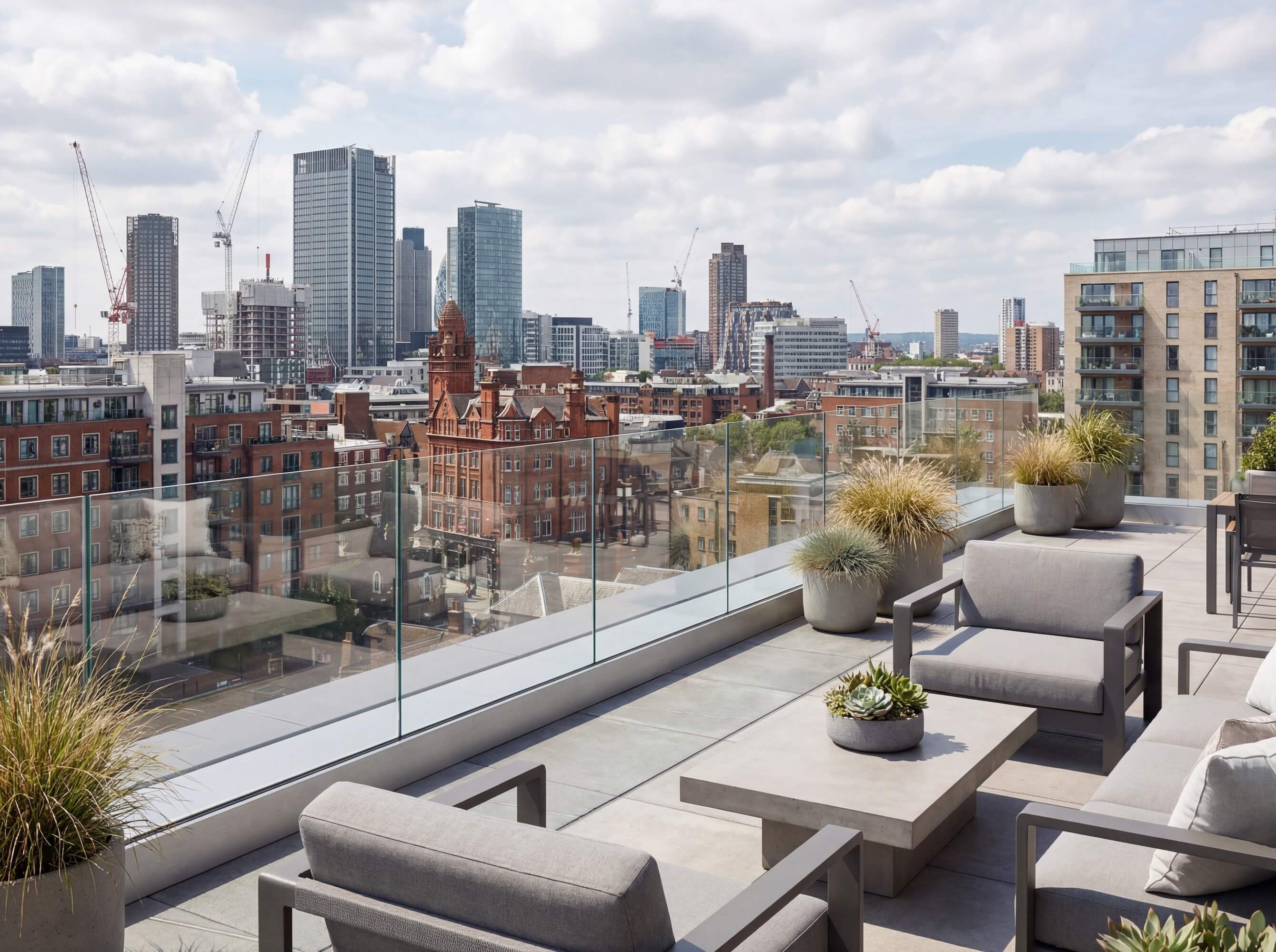 City balcony fitted with a fully frameless glass balustrade, creating a sleek and contemporary outdoor space
