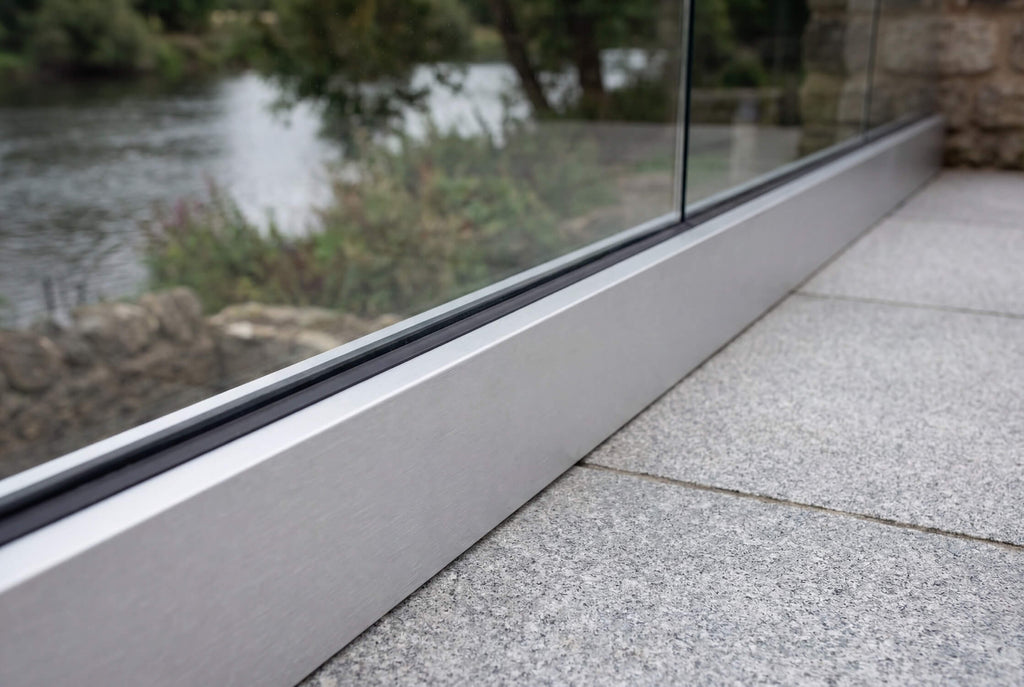 Close-up of fully frameless silver glass balustrade installed on a residential balcony