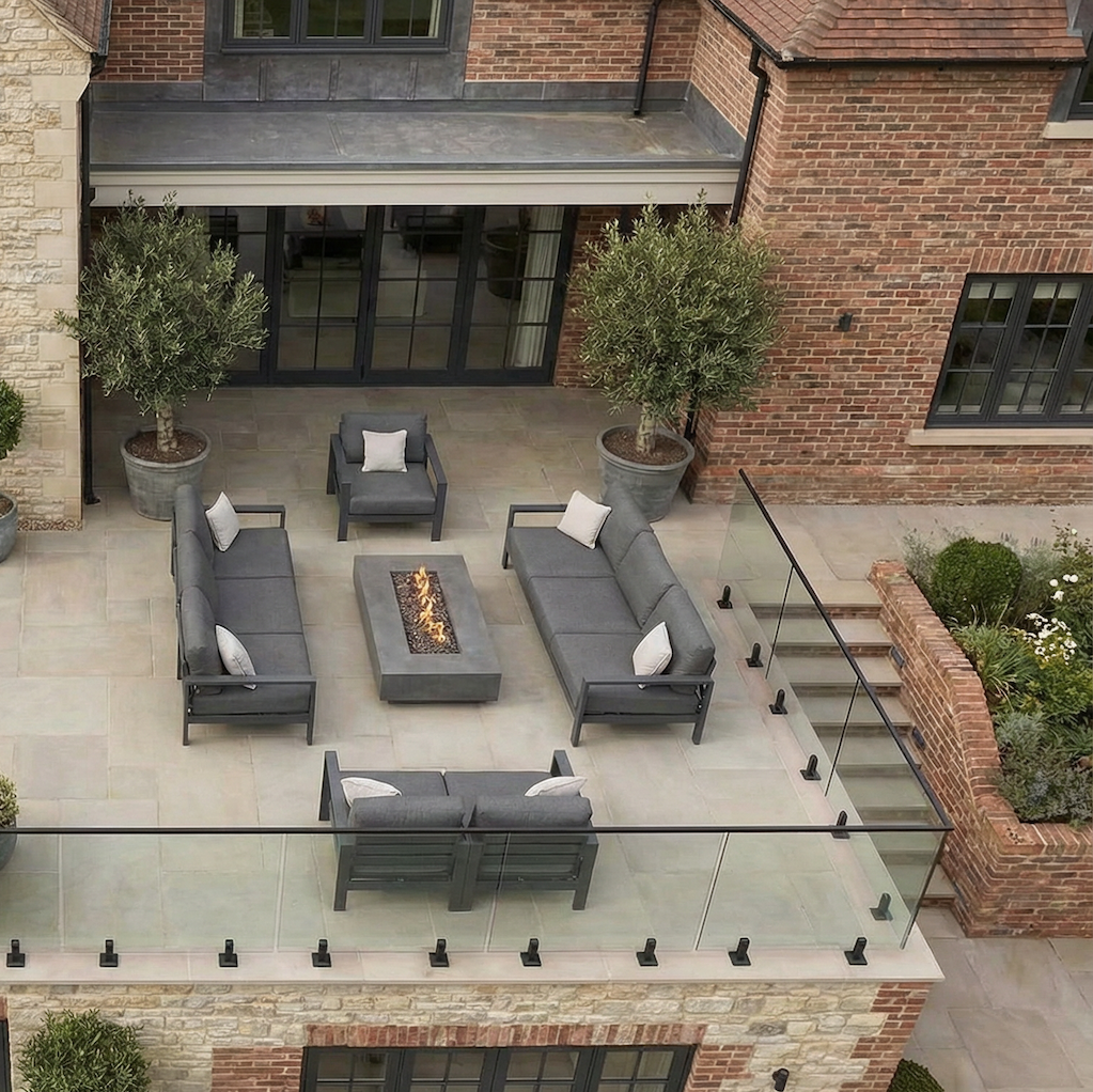 Outdoor glass balustrade system featuring black spigots, suitable for decking edges, balconies, and raised platforms