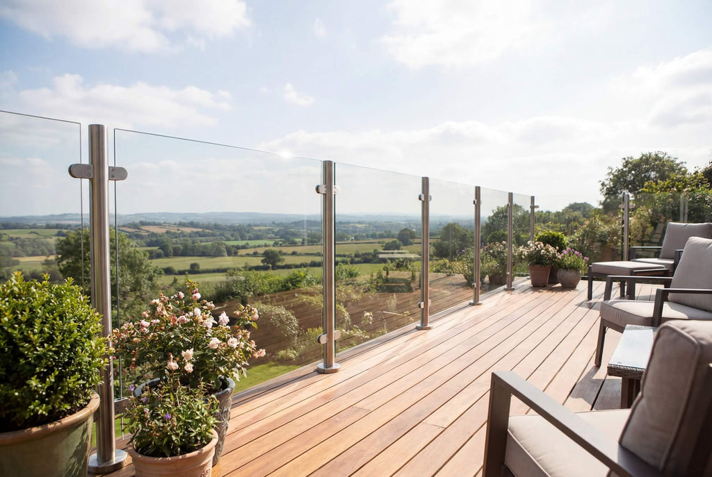 Satin silver semi frameless glass balustrade on raised garden decking area