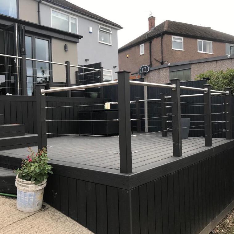 Midnight Black Composite Decking with balustrades and wire railings.