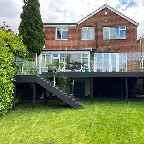 semi frameless glass balustrade on a raised decking