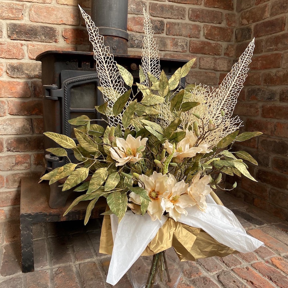 artificial magnolia and stencil leaf bouquet