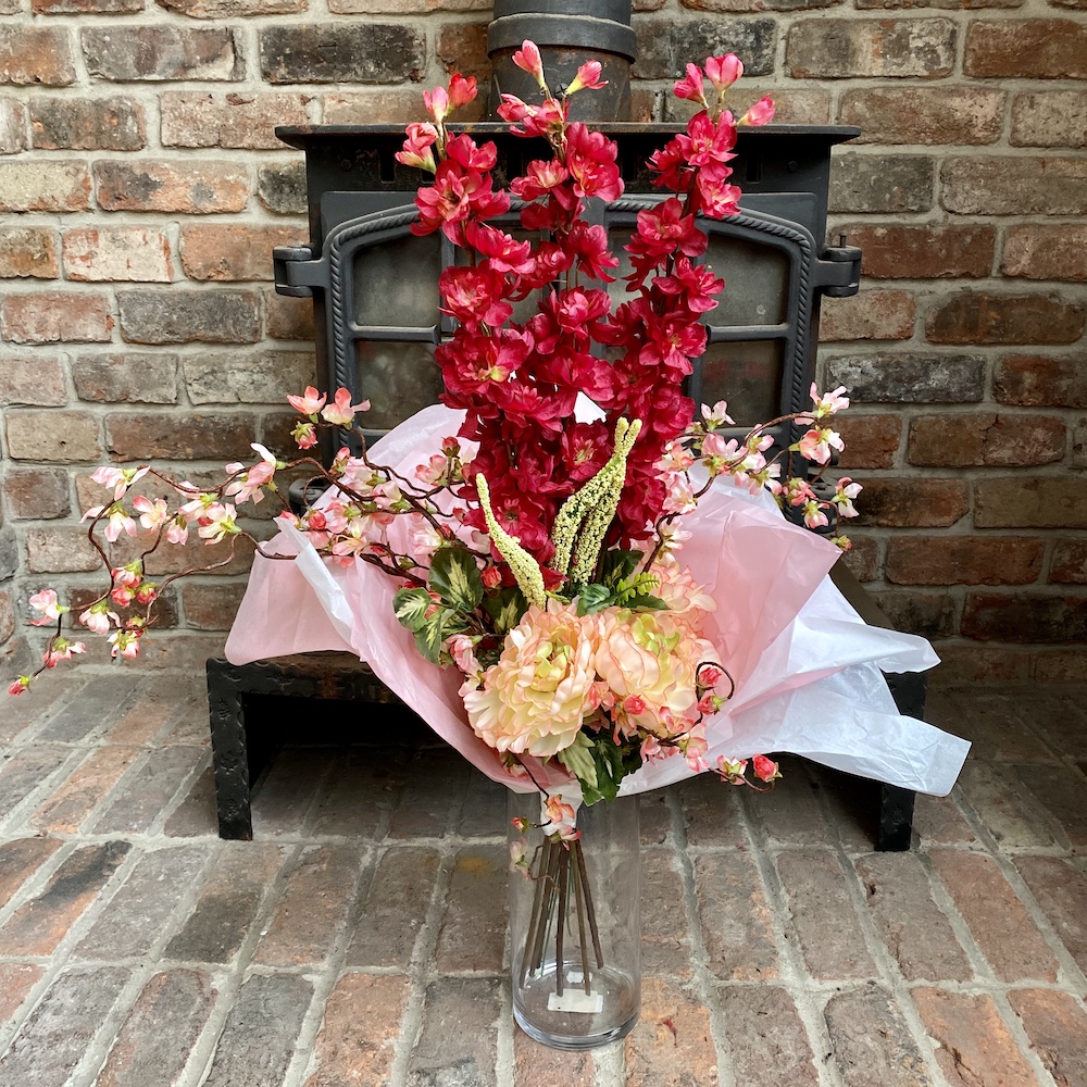 Artificial cherry blossom bouquet with red delphiniums