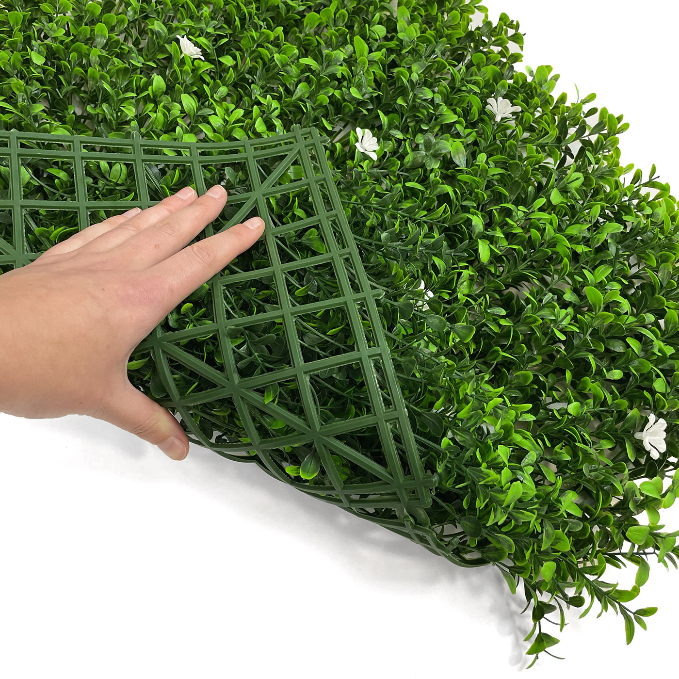 artificial boxwood flower hedge tile showing flexibility