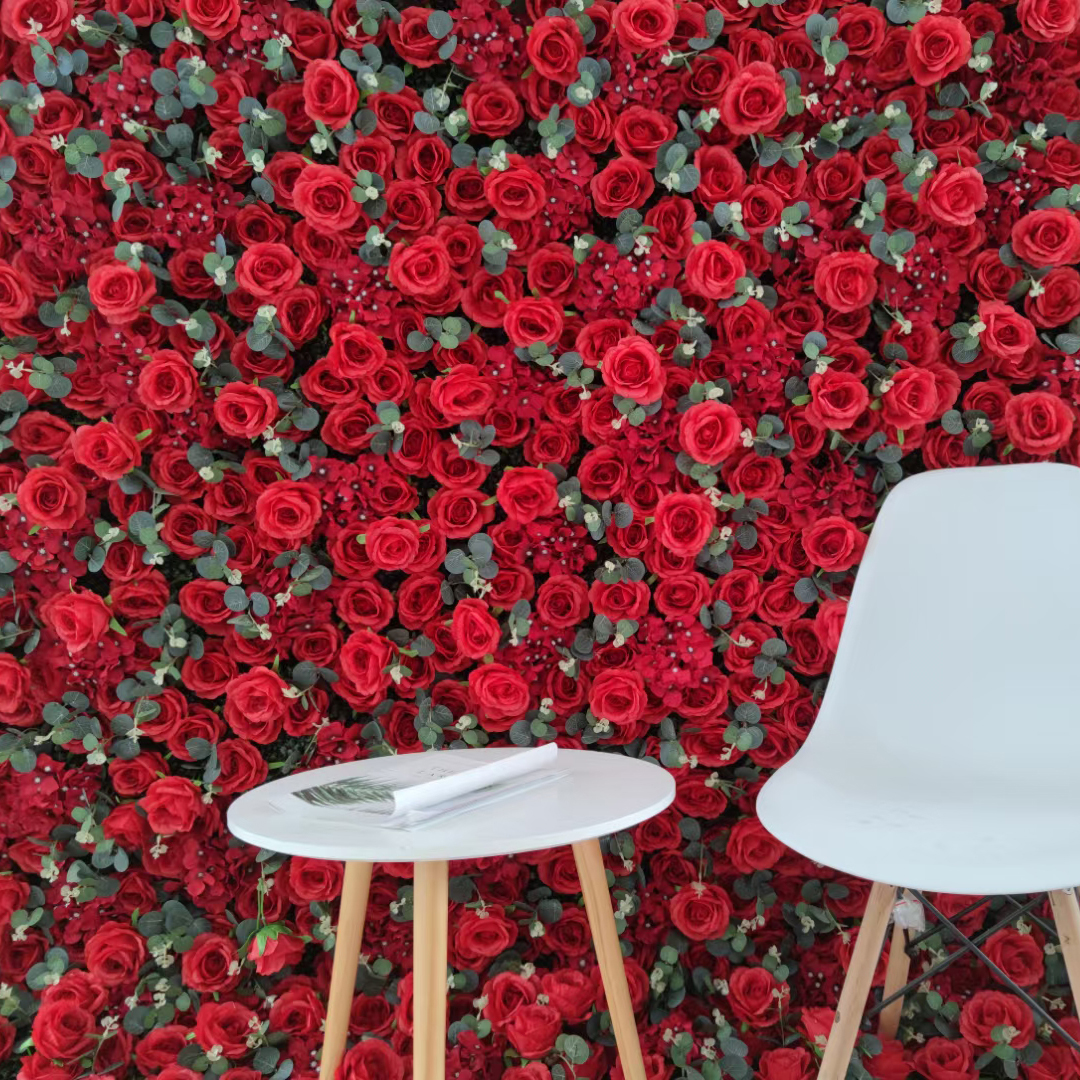 artificial red roses flower wall with sprigs of eucalyptus