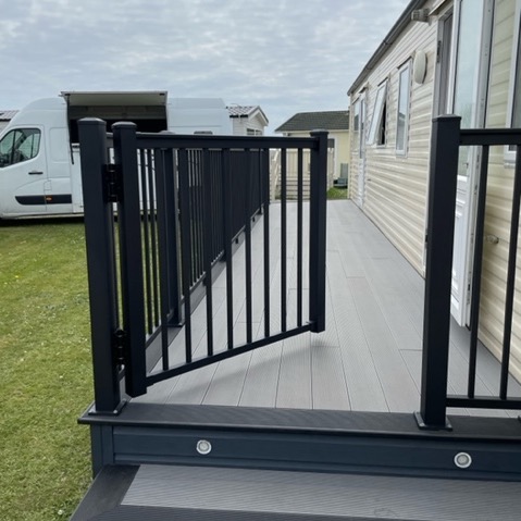 black powder coated aluminium gate attached to the aluminium balustrade