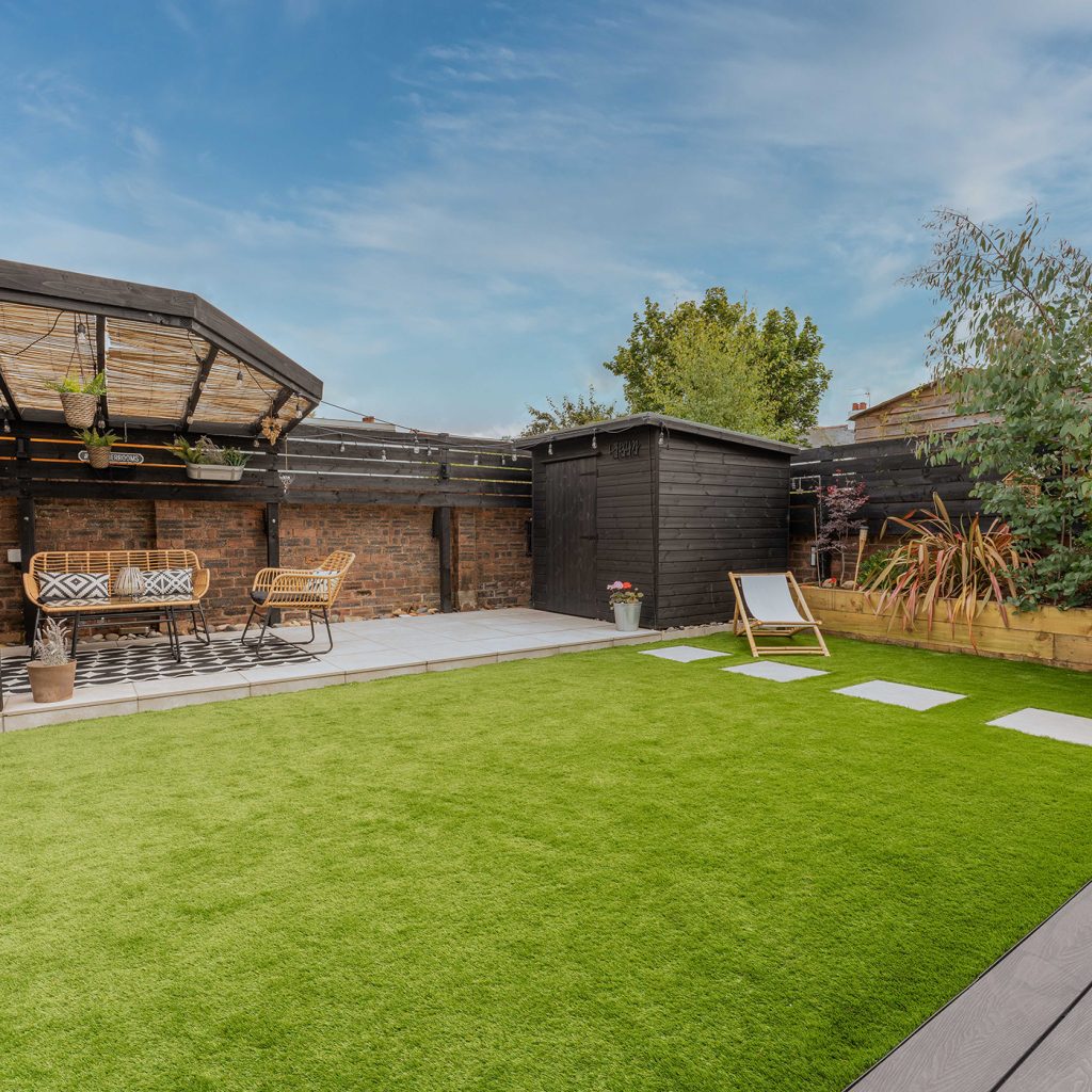 Artificial grass lawn in family garden creating a safe space for children to play on