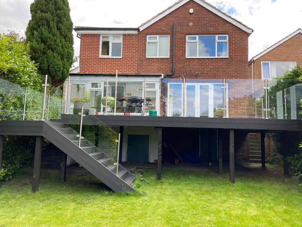 semi frameless glass garden railings system used on a raised decking