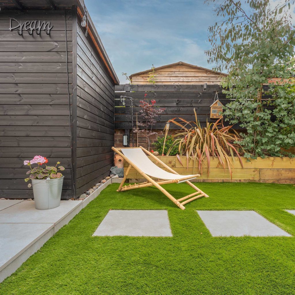 faux grass lawn laid with porcelain tiles to break up the space.