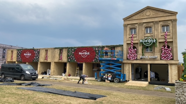 floral arrangements on a large scale event stage adding impact to the event set up