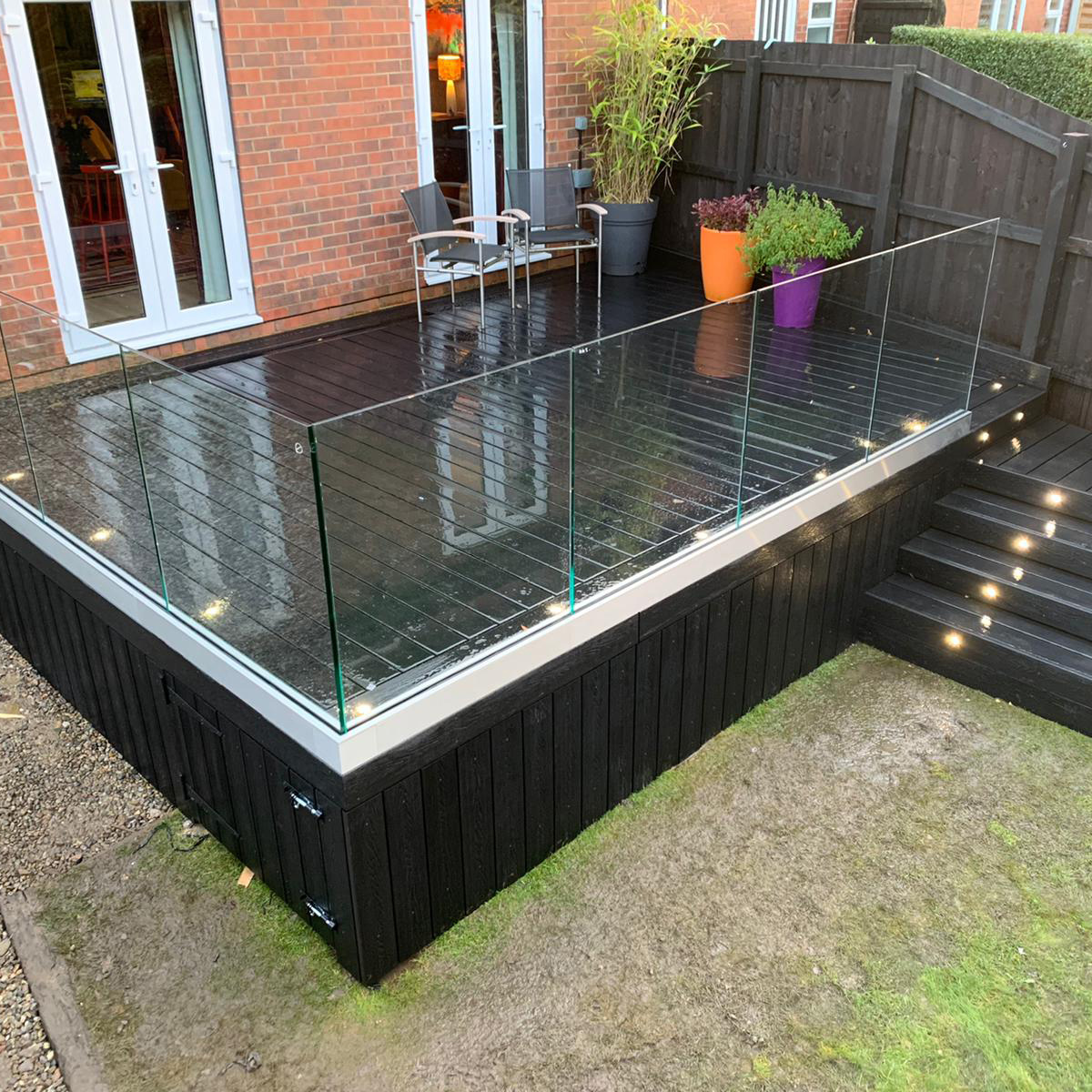 fully frameless glass balustrade installed onto raised composite decking